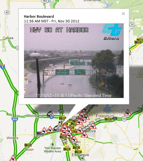 CCTV at HWY 50 and Harbor Blvd in Sacramento displaying stormy weather conditions along highway.